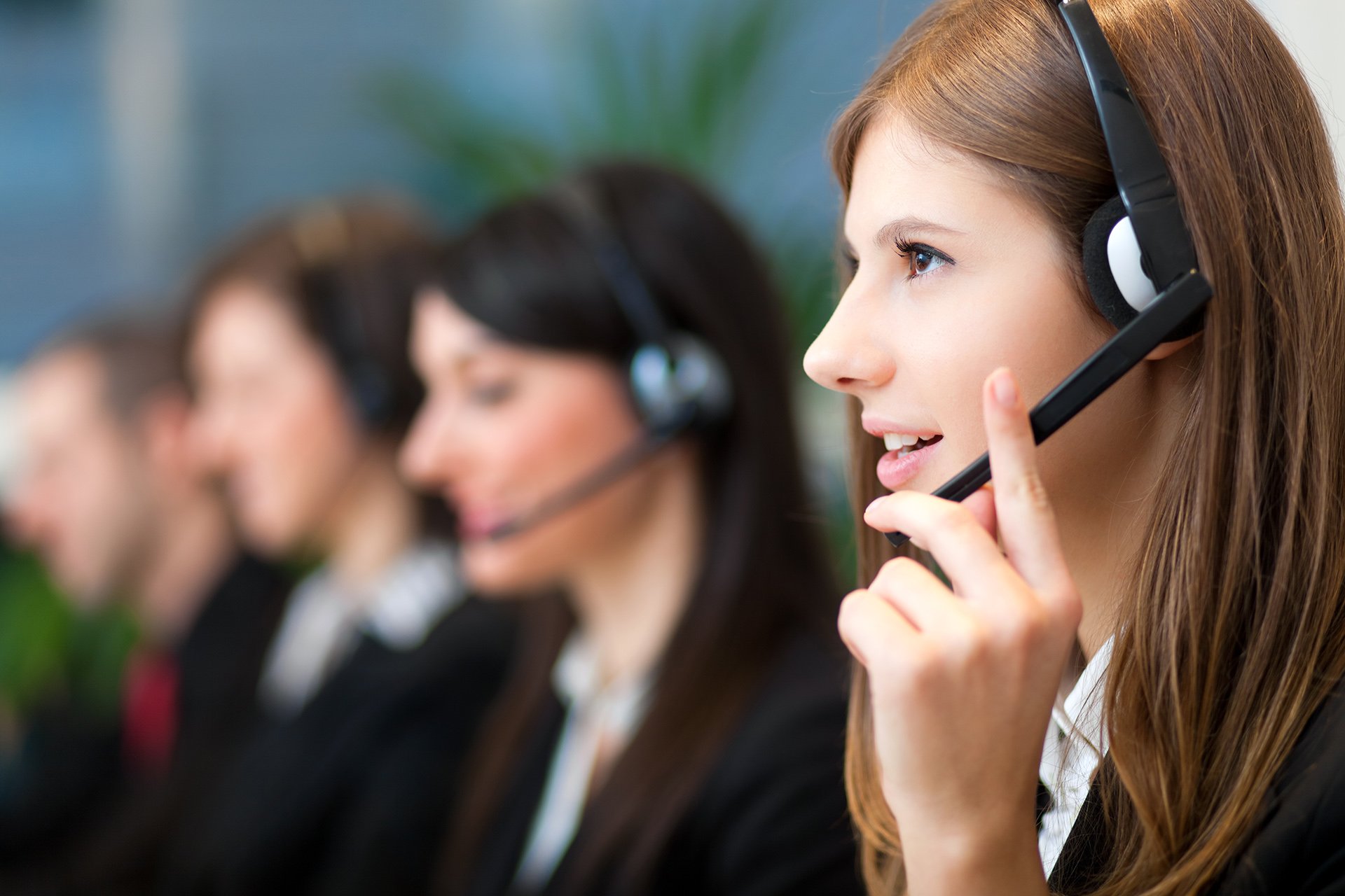 People answering customer calls at a call center