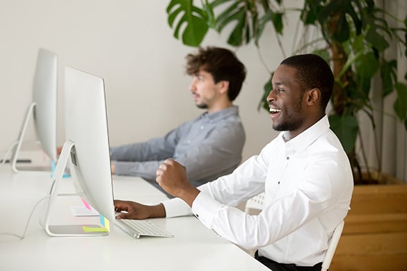 Employee celebrating online win at work