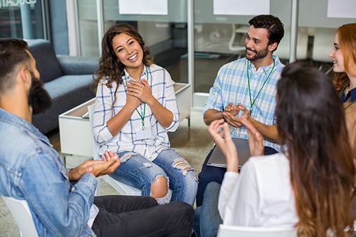 Employees appreciating their colleague